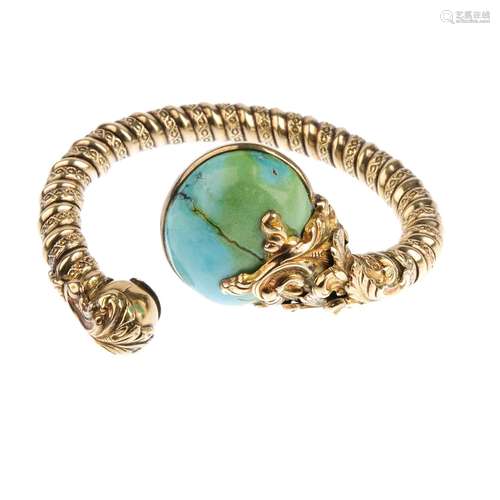 A turquoise cuff. The textured cuff, with oval turquoise cabochon and foliate terminals. Estimated