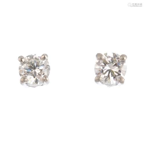 A pair of platinum brilliant-cut diamond stud earrings. Estimated total diamond weight 0.35ct, H-I