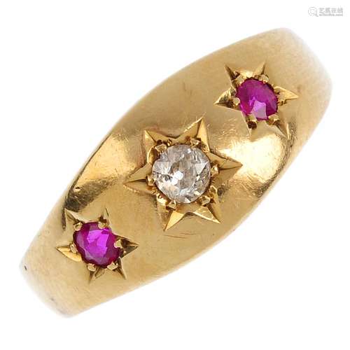 An early 20th century 18ct gold diamond and synthetic ruby three-stone ring. The graduated