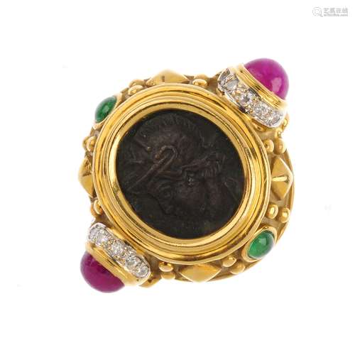 A diamond and gem-set dress ring. The collet mounted oval central panel depicting a Roman Centurion,