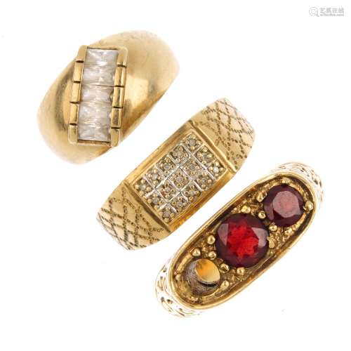(52315) Three 9ct gold gem-set rings. To include a diamond signet ring, a diamond band ring,