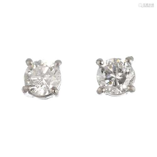 A pair of platinum brilliant-cut diamond stud earrings. Estimated total diamond weight 0.80ct, H-I