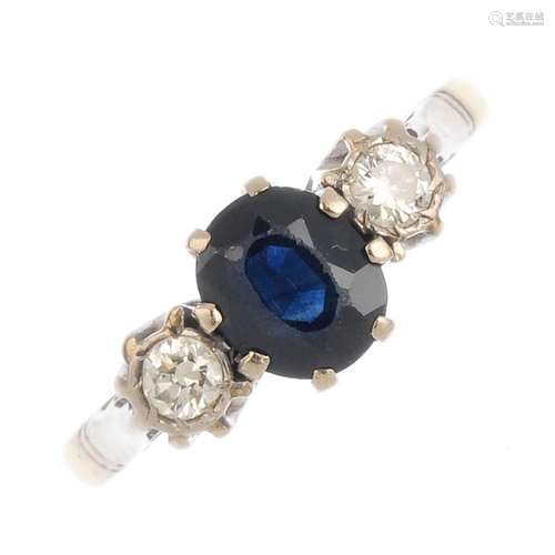 A sapphire and diamond three-stone ring. The oval-shape sapphire, with brilliant-cut diamond