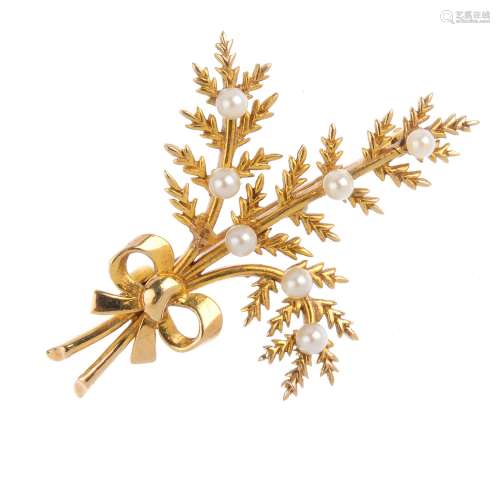 A 9ct gold seed pearl brooch. Designed as a spray of fern leaves tied in a ribbon, with seed pearl