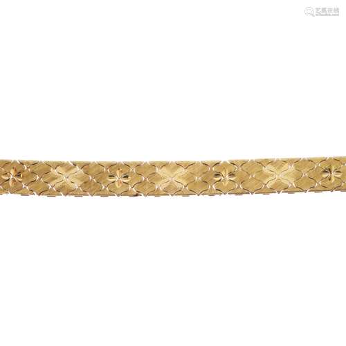 A bracelet. Designed as a series of textured fancy integral-links, with partially concealed push-