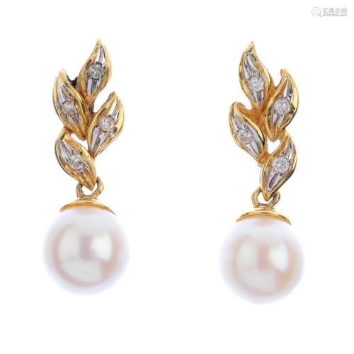 A pair of 18ct gold cultured pearl and diamond earrings. Each designed as a cultured pearl,