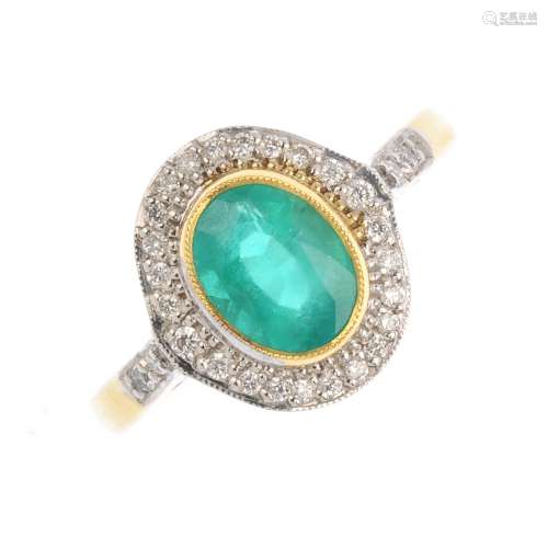 An 18ct gold emerald and diamond cluster ring. The rectangular-shape emerald collet, with a