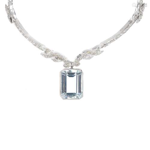 A diamond and aquamarine necklace. The rectangular-shape aquamarine, suspended from an integral