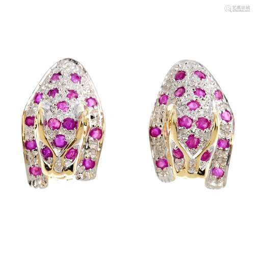 A pair of 9ct gold ruby and diamond earrings. Each designed as a leopard, with circular-shape