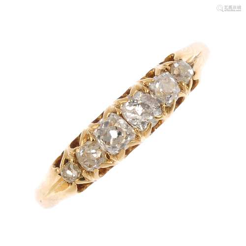 A late Victorian 18ct gold diamond six-stone ring. The graduated old-cut diamond line, with