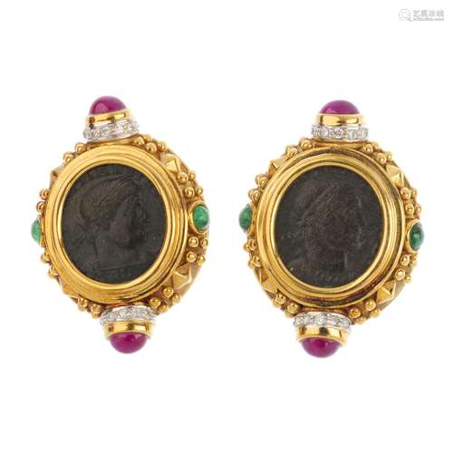 A pair of diamond and gem-set earrings. Each designed as a token, with textured bead sides and