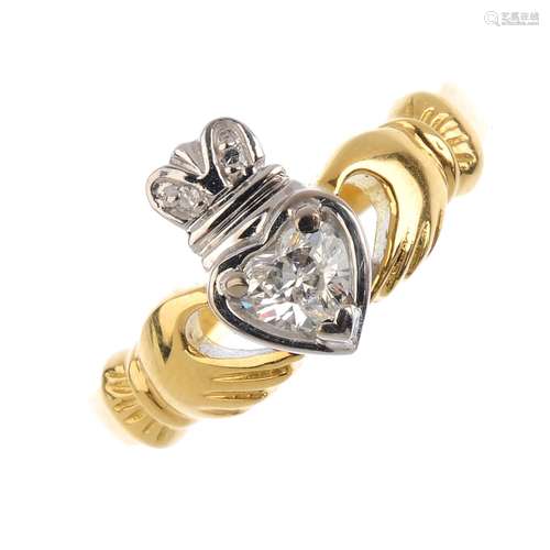 An 18ct gold diamond Claddagh ring. The heart-shape diamond, with single-cut diamond crown