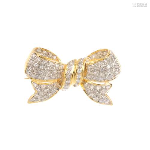 A diamond bow brooch. Designed as a stylised bow, set throughout with brilliant-cut diamonds.