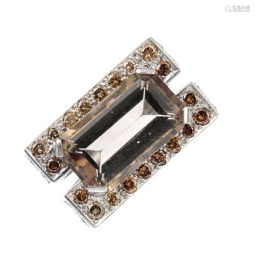 A coloured diamond and smoky quartz ring. The rectangular-shape smoky quartz, within a brilliant-cut