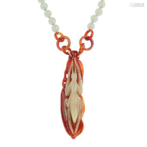 A jade necklace. The jadeite pendant carved to depict a praying mantis front and foliate reverse,
