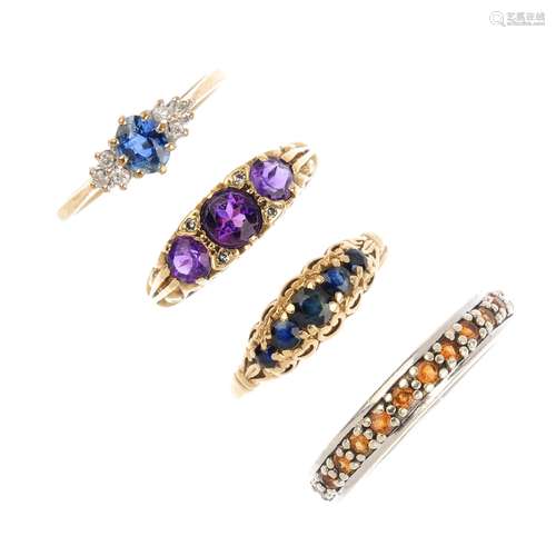 Four 9ct gold gem-set rings. To include a sapphire five-stone ring, an amethyst and diamond dress