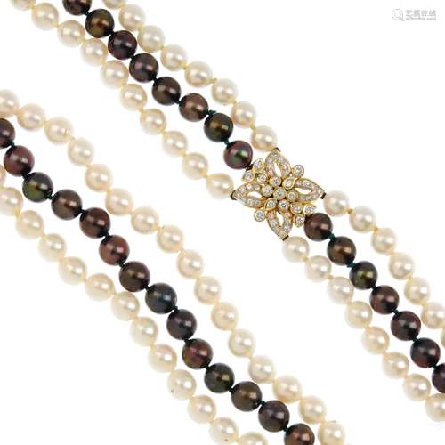 A cultured pearl three-row necklace with diamond clasp. Comprising three different coloured cultured