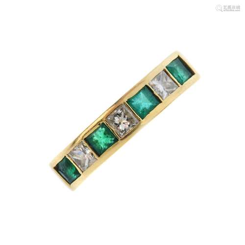 An emerald and diamond seven-stone ring. The alternating square-shape emerald and diamond collet