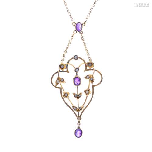 An early 20th century 9ct gold amethyst and split pearl pendant. Of openwork design, the oval-