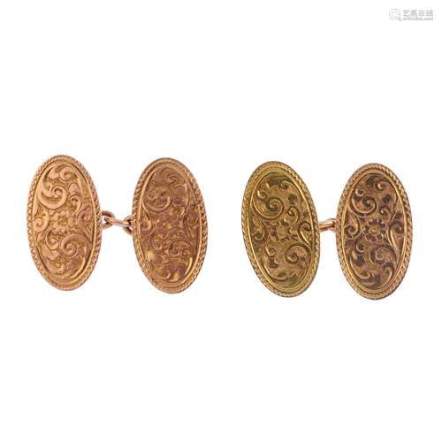 A pair of 1920s 9ct gold cufflinks. Each designed as two oval panels, with engraved floral motif and