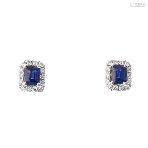 A pair of sapphire and diamond cluster ear studs. Each designed as a central rectangular-shape