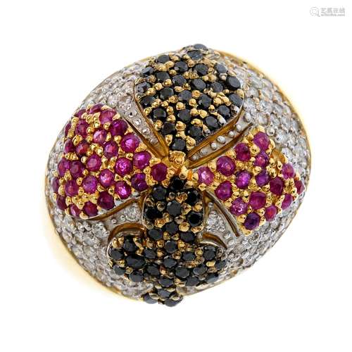 A diamond and gem-set novelty ring. The pave-set diamond dome, with ruby and black gem playing