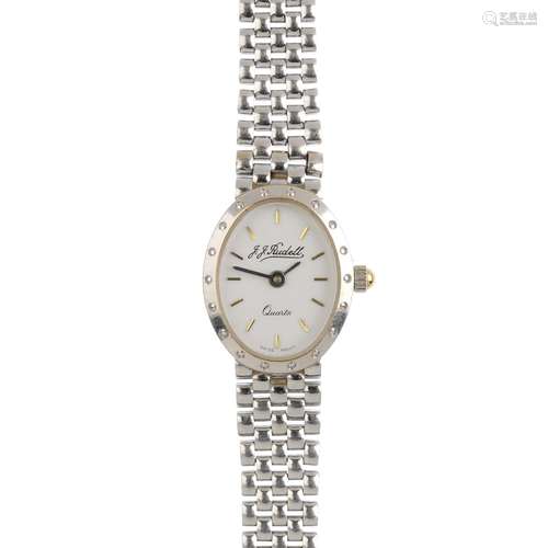 A 14ct white gold lady's wristwatch. The oval white dial, with integral brick-link bracelet.