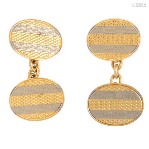 A pair of mid 20th century 18ct gold cufflinks. Each designed as two oval bi-colour panels, with