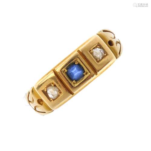 A late 19th century 18ct gold paste and diamond three-stone ring. The circular-shape blue paste,