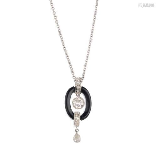 A diamond and onyx pendant. The brilliant-cut diamond collet, within an onyx halo surround, with