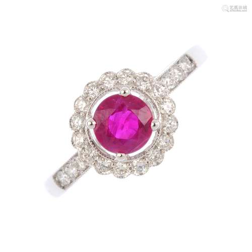 An 18ct gold ruby and diamond cluster ring.