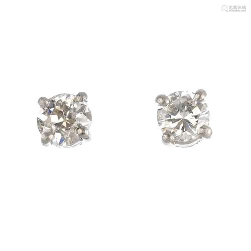 A pair of platinum brilliant-cut diamond stud earrings. Estimated total diamond weight 0.50ct, H-I