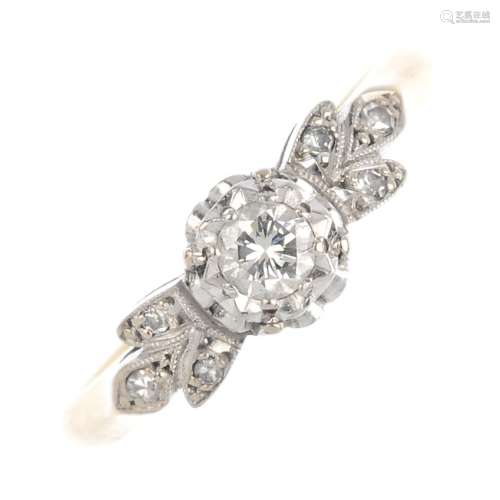 An 18ct gold diamond dress ring. The brilliant-cut diamond with single-cut diamond trefoil sides.