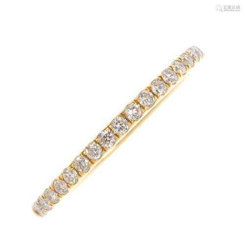An 18ct gold diamond half eternity ring. Designed as a brilliant-cut diamond line. Total diamond
