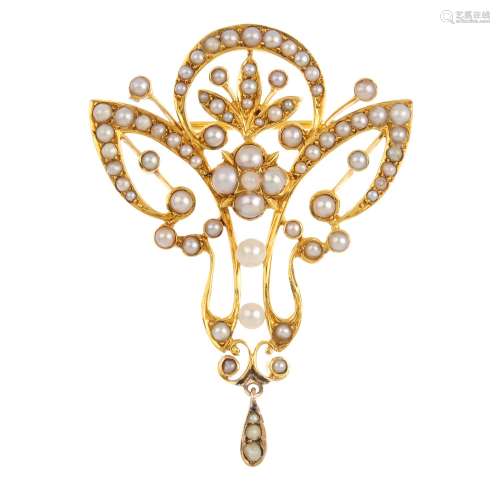 An early 20th Century seed and split pearl brooch. The openwork brooch, set throughout with seed and