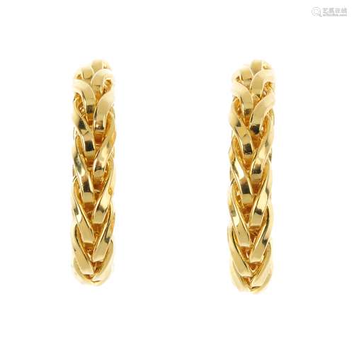 A pair of 18ct gold earrings. Each designed as a woven hoop. Hallmarks for London. Length 2.3cms.