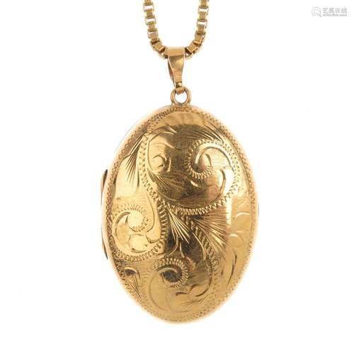 A 9ct gold locket. Of oval outline, the engraved front, with plain reverse, suspended from a 9ct