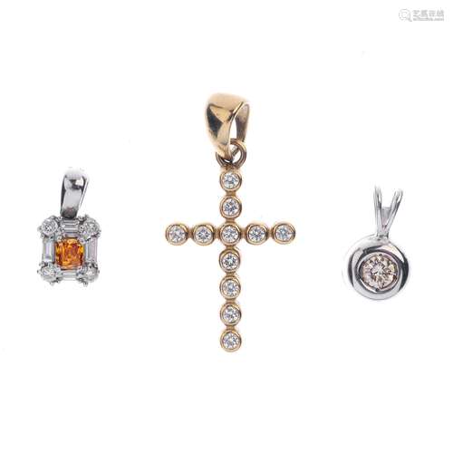 Three gem-set pendants. To include a 9ct gold colourless gem-set cross pendant, an 'orange'