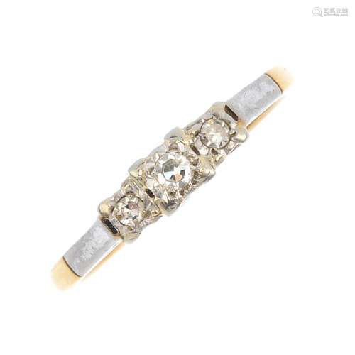 An 18ct gold and platinum diamond three-stone ring. The graduated single-cut diamond stepped line,