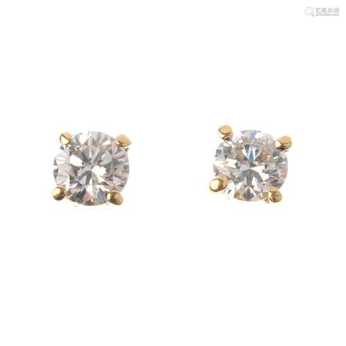 A pair of 18ct gold brilliant-cut diamond stud earrings. With mini report 20034449, from AnchorCert,