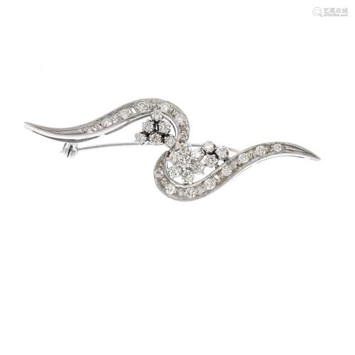 A diamond brooch. The brilliant-cut diamond scrolling line, supporting similarly-cut diamond