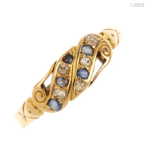 An Edwardian 18ct gold ring mount and a gem-set dress ring. The first, designed as a buckle, with