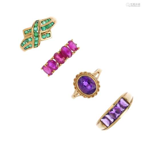 Four gem-set rings. To include a 9ct gold emerald dress ring, a 9ct gold amethyst single-stone ring,