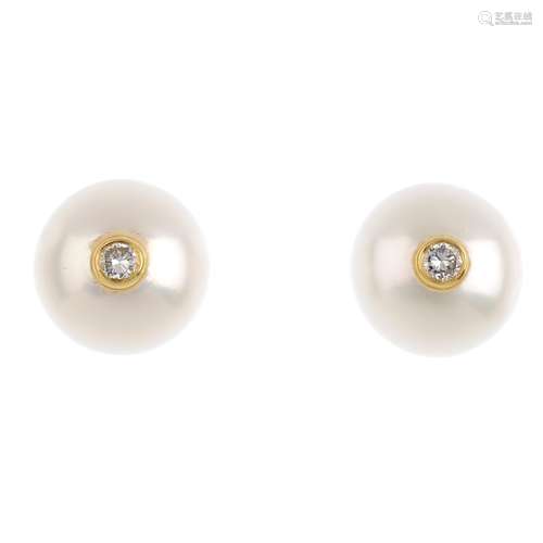 A pair of 18ct gold cultured pearl and diamond ear studs. Each designed as a cultured pearl with