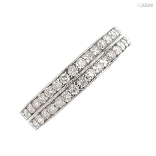 A 9ct gold diamond half eternity ring. Designed as a brilliant-cut diamond double row, with