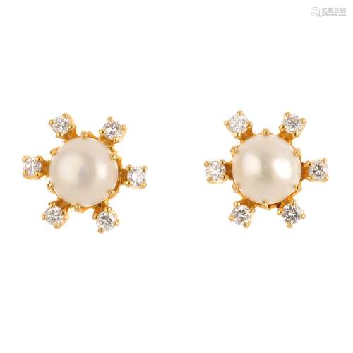 A pair of cultured pearl and diamond cluster earrings. Each designed as a cultured pearl, within a