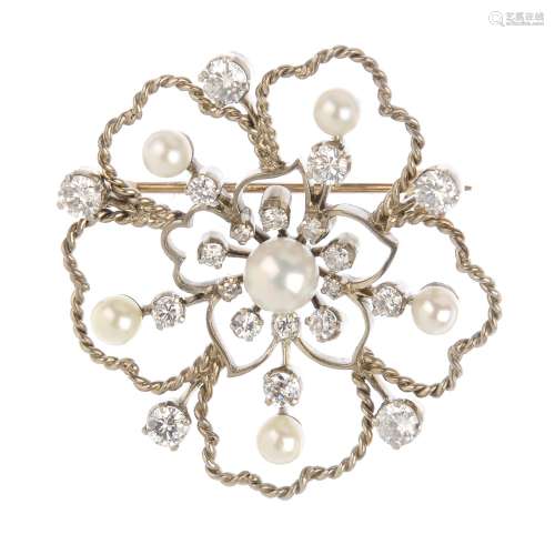 A diamond and cultured pearl brooch. Of floral design, the cultured pearl and vari-cut diamond