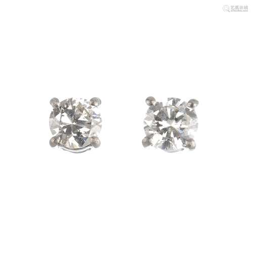 A pair of platinum brilliant-cut diamond stud earrings. Estimated total diamond weight 0.75ct , H-