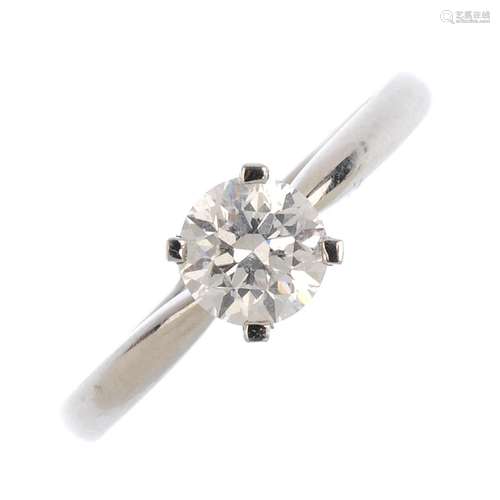 A platinum diamond single-stone ring. The brilliant-cut diamond with tapered shoulders. Diamond