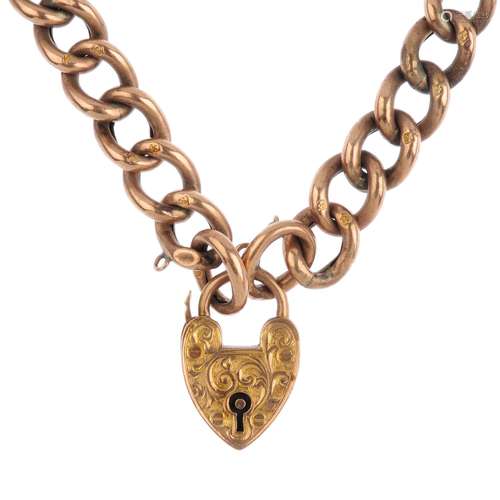 An early 20th century gold bracelet. Designed as a series of polished and textured curb links,